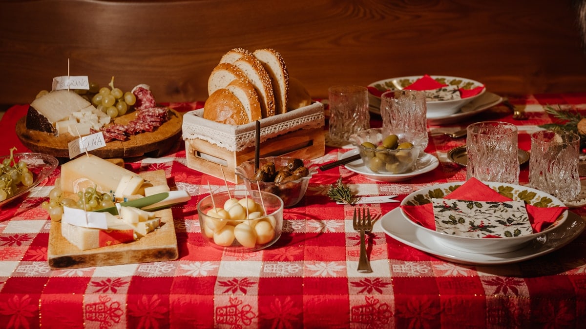 a table topped with plates and bowls of food